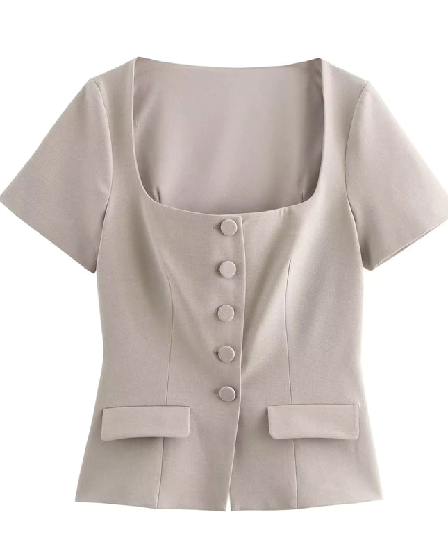 Beige short-sleeve blouse with buttons on a white background