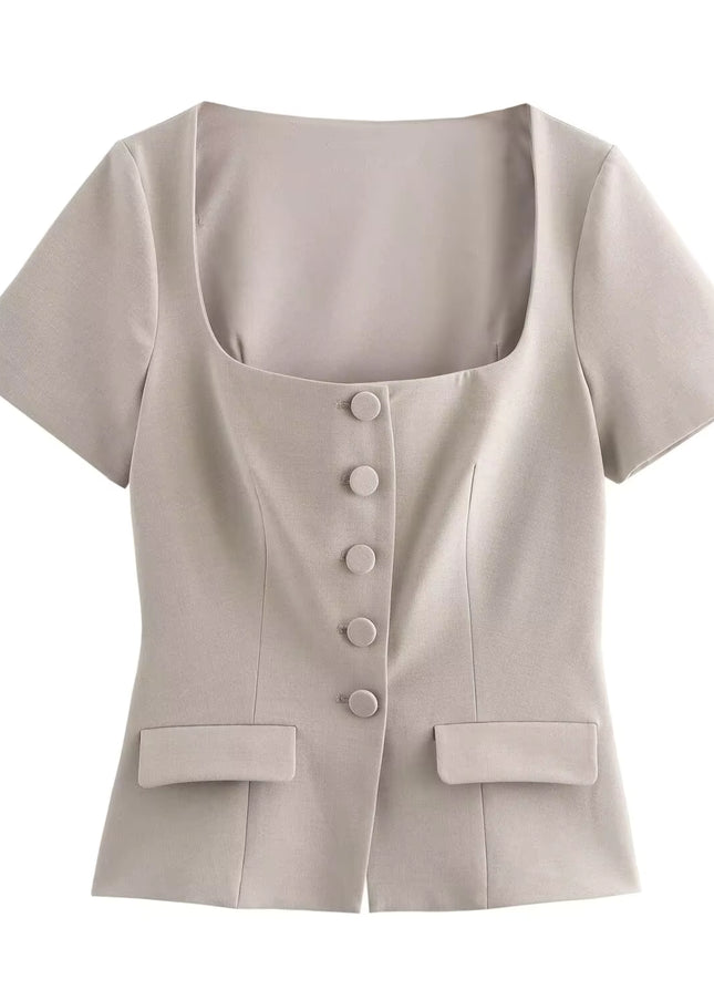 Beige short-sleeve blouse with buttons on a white background